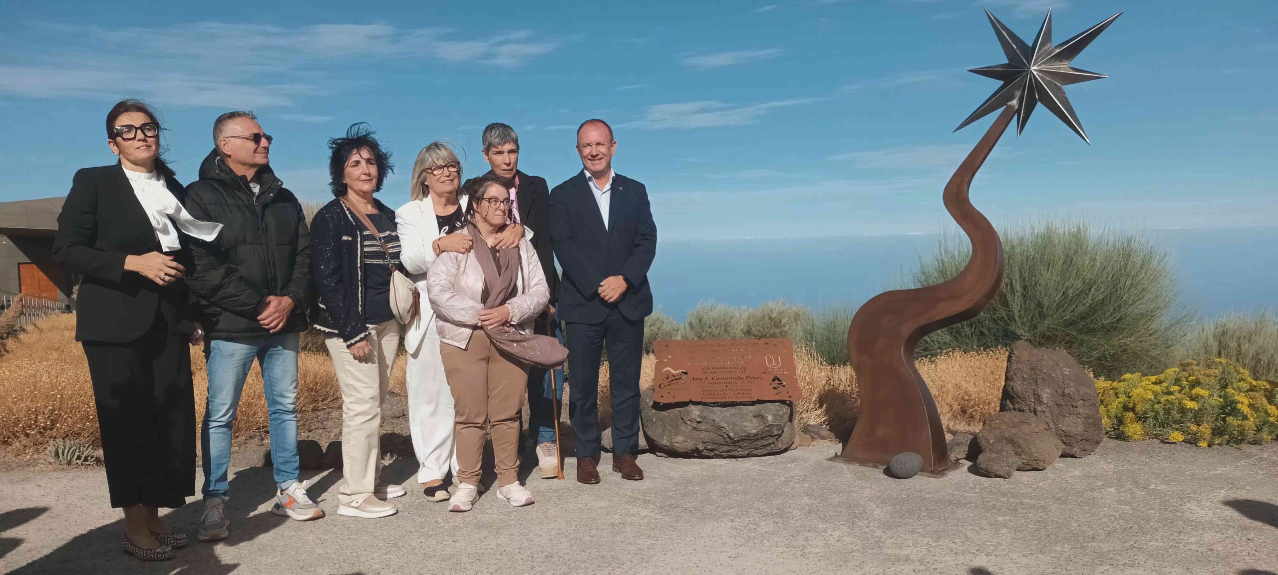 Ana's family are to the left, while the sculpture is to the right. It shows a large star zig-zagging up to the sky.
